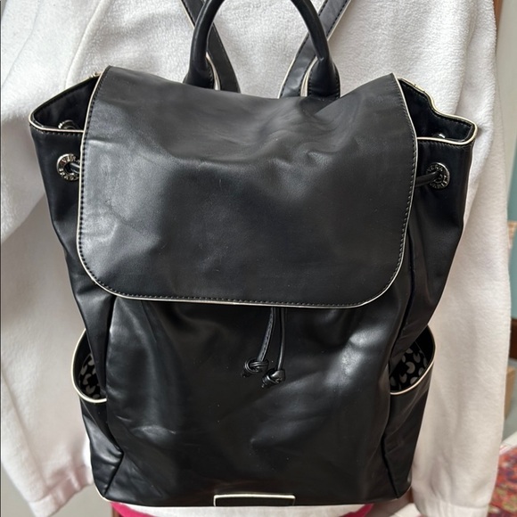 Vera Bradley Handbags - Vera Bradley  backpack   vegan leather  black/white edging cinch top/flap NWOT